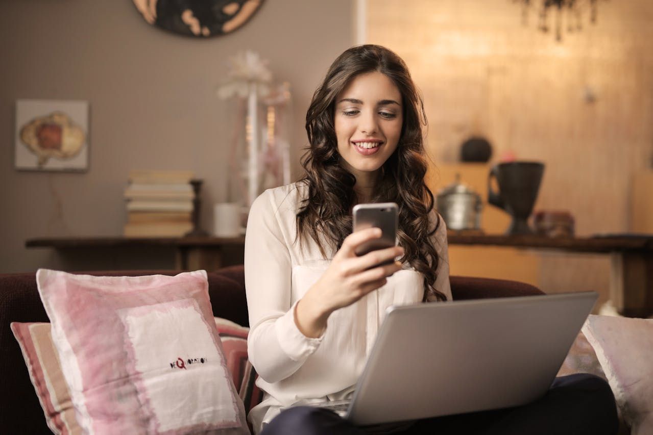 Woman on couch with phone